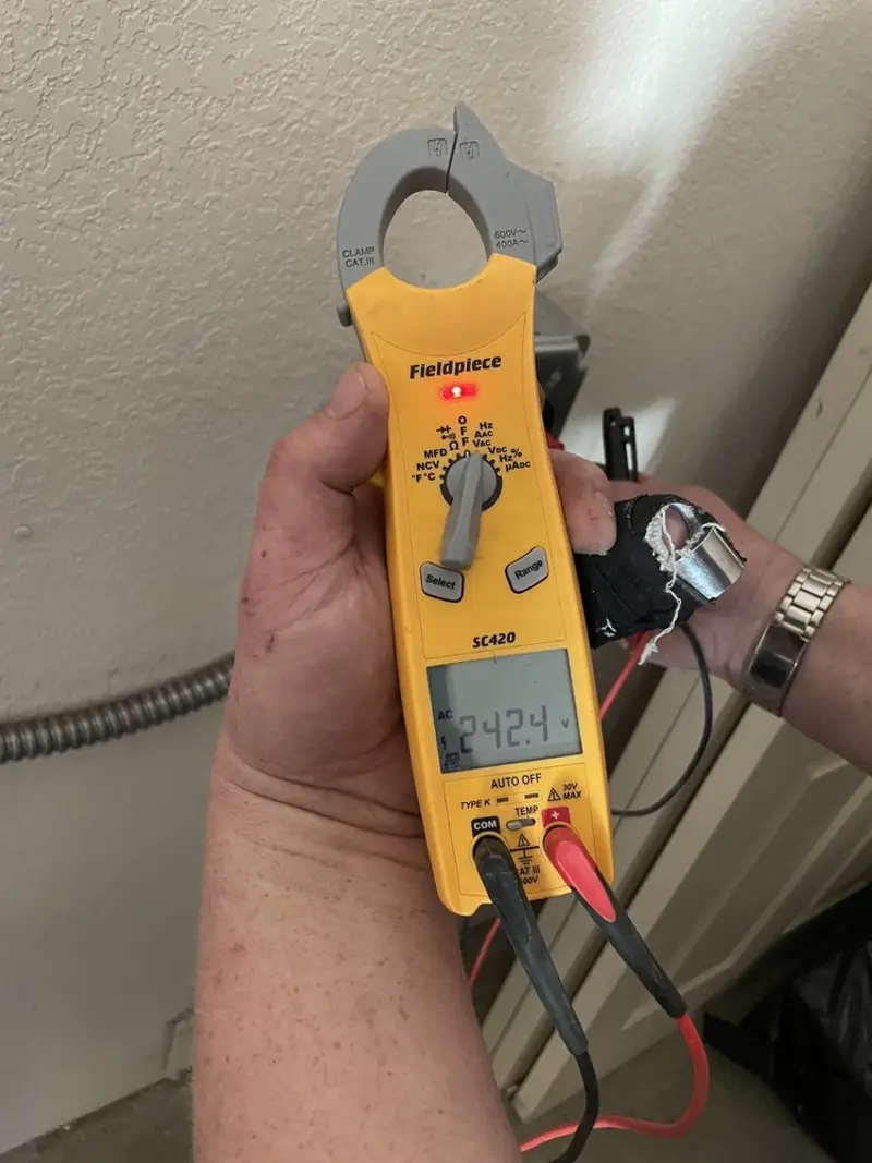 Voltage testing with clamp meter during Generator Installation in San Carlos
